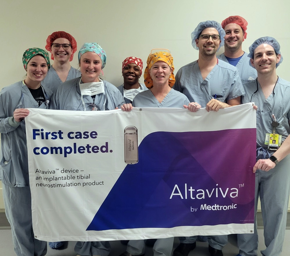 dr. crisp and team holding sign for altaviva