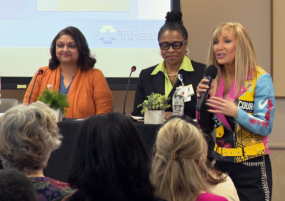 staff at Women's Wellness event with Liz Bonis from channel 12