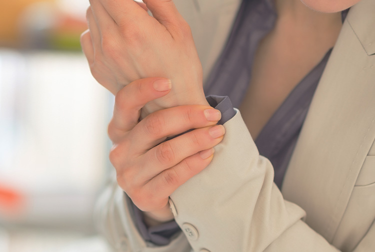 woman holding wrist