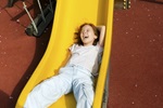 girl on slide smiling