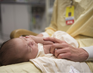 nurse holding a baby
